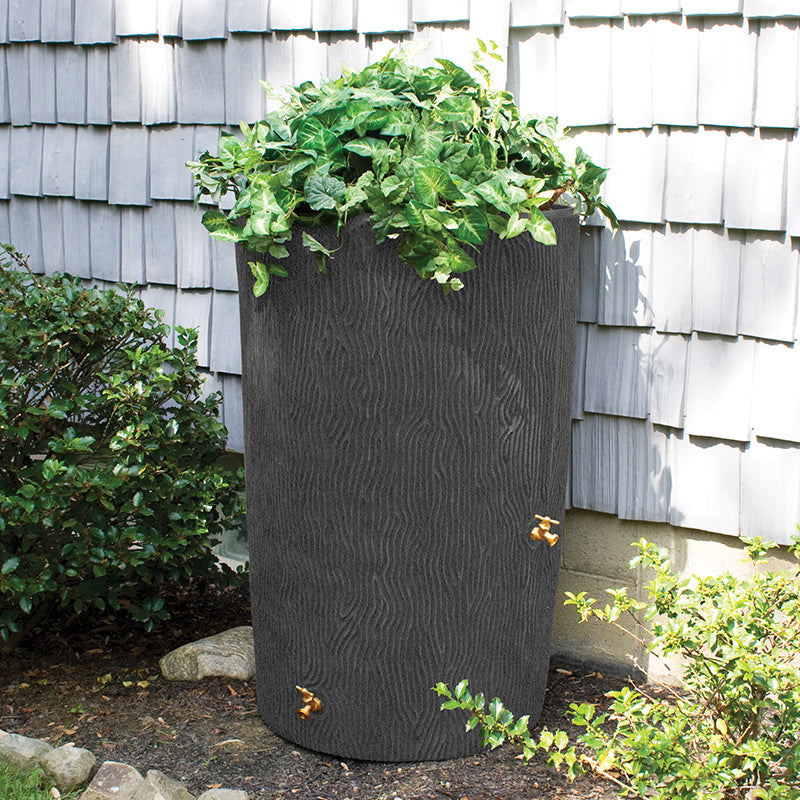 This is a photo of the Impressions Bark 50 Gallon Rain Saver. When clicked this link takes you to shop our rain barrel products.