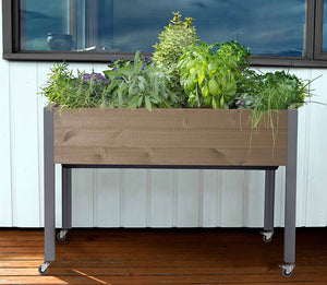 Self-Watering Elevated Spruce Planter (21" x 47" x 32") on deck