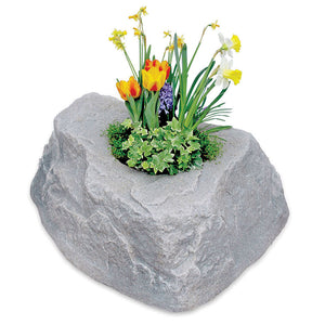 Planter Faux Rock 132 in Fieldstone with flowers planted