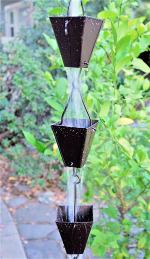 Bronze Tapered Square Cups Rain Chain with water flowing through multiple cups