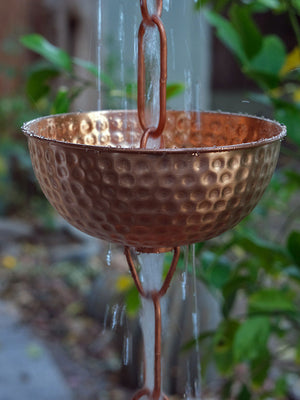 water running through Singing Bowls™ Copper Rain Chain