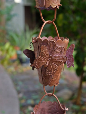 Butterfly Theme Copper Rain Chain with intricate copper butterflies on each cup