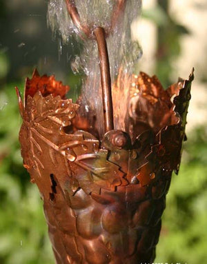 Grape Leaf Theme Copper Rain Chain with water flowing through cup