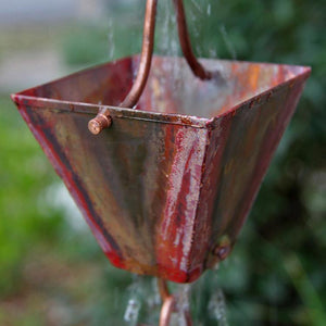 Medium Square Cups Aged Copper Rain Chain with water flowing through cup
