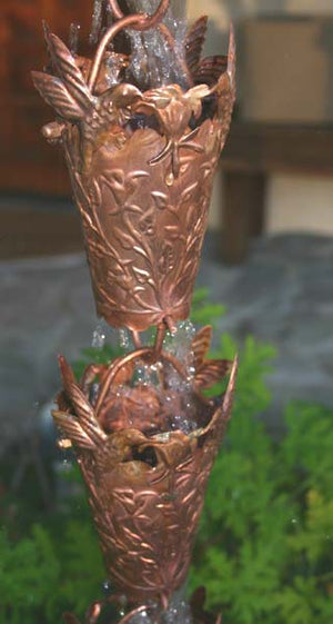 Hummingbird Theme Copper Rain Chain with water flowing through multiple cups