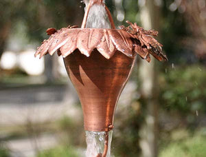 Sunflower Copper Rain Chain with bee accent and water flowing through cup