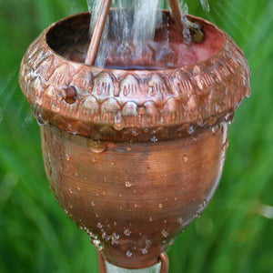 Acorn Cups Copper Rain Chain with water flowing through single cup