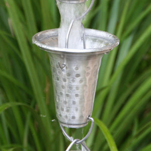 Flared Cups Rain Chain in aluminum with water flowing through cup