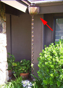Corner copper Leaderhead for Rain Chains installed on home with copper rain chain