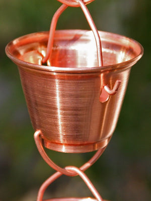 close up view of single copper Shizuka Cups Rain Chain