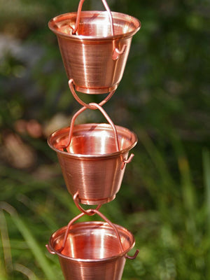 close up of three cups in copper Shizuka Cups Rain Chain