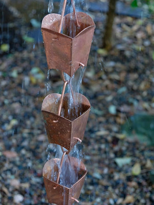 Square Tulip Copper Cups Rain Chain with water flowing through multiple cups