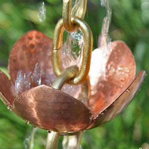 Tara Flower Copper Cup Style Rain Chain with water flowing through cup
