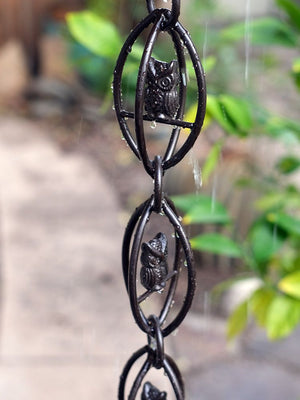 Owls Rain Chain in Bronze during rain