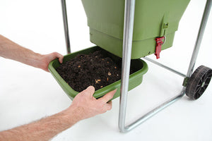 This is an image of emptying the bottom tray of the Hungry Bin with compost.