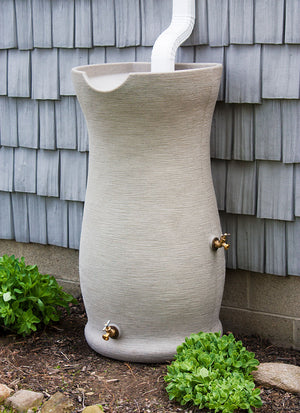 Impressions 50 Gallon Corsican Rain Saver next to a grey house