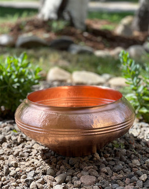 Copper Bella Basin in landscaping