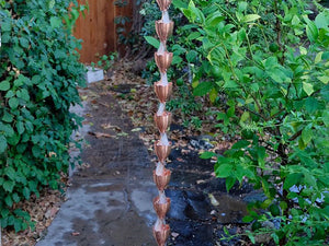 Copper Cup Style Rain Chain with water flowing through it