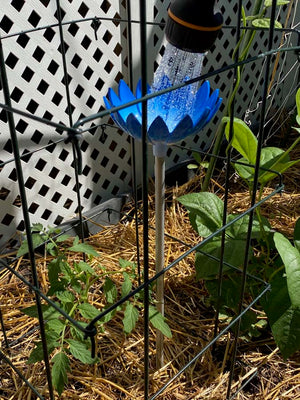 Jazmine Root Waterer in Bluebell irrigating a vegetable garden