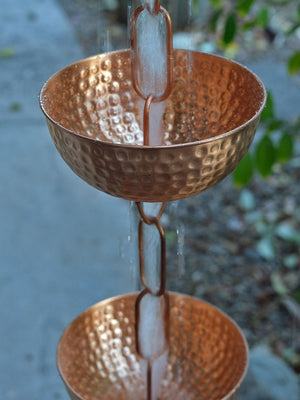 top view of watering running through Singing Bowls™ Copper Rain Chain