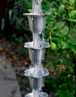 Aluminum Flower Cups Rain Chain with water flowing through multiple cup