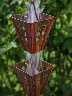 Pure copper Arts & Crafts Square Cups Rain Chain during a rainstorm