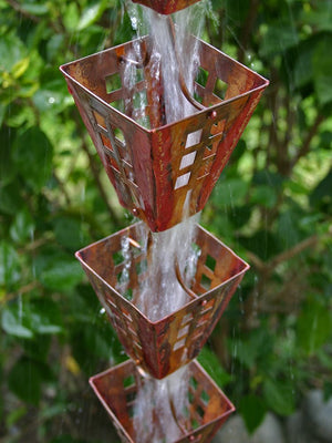 Arts & Crafts Copper Square Cups Rain Chain with water flowing through multiple cups