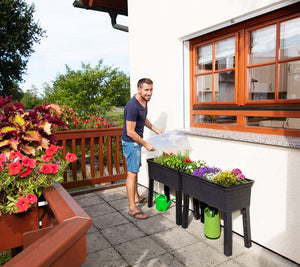 Balcony Raised Bed Planters on a deck with cover being removed