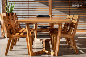 Casares Teak Dining Chair around table