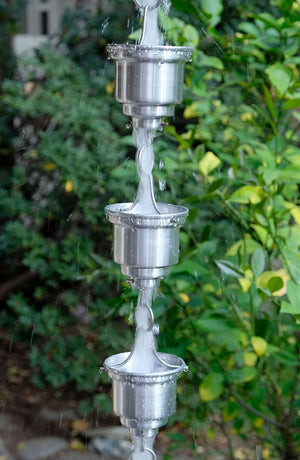 Aluminum Naoki Cups Rain Chain with water flowing through multiple cups