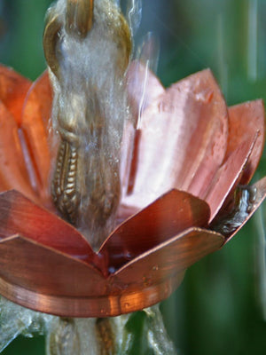 Close up of Double Lotus Rain Chain made of copper and brass