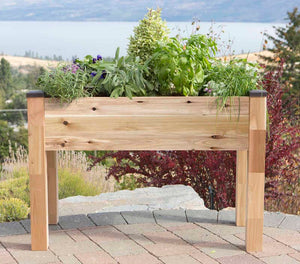 Elevated Cedar Planter (34" x 49" x 30") on patio