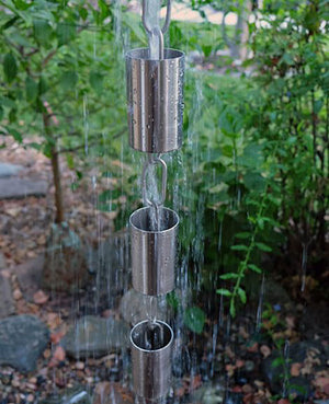 Kenchiku Rain Chain in Stainless Steel with water running through cups