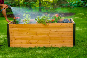 Mezza 3x5 Keyhole Composting Garden being watered