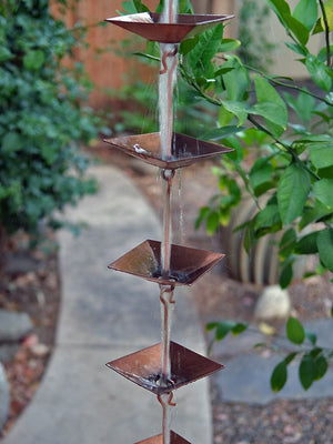 Pagoda Cups copper plated rain chain with water flowing through cups
