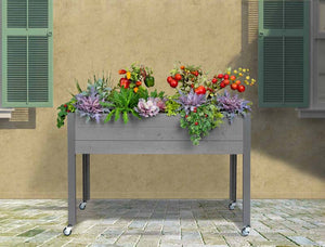 Self-Watering Elevated Spruce Planter (21" x 47" x 32") in gray on a patio Self-Watering Elevated Spruce Planter (21" x 47" x 32") on patio 
