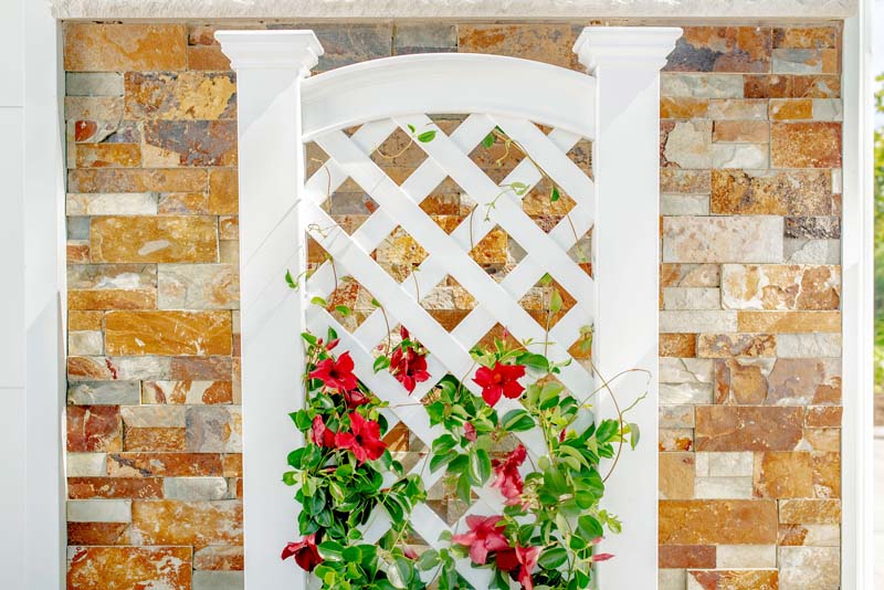 Kensington Planter with Trellis growing flowers