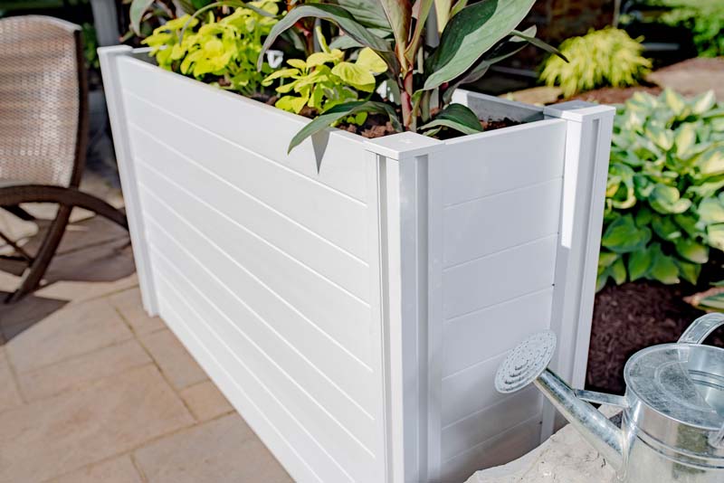 Classic Parklette Planter next to garden
