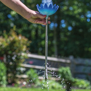 Water running through the stem of a Jazmine Root Waterer in Bluebell
