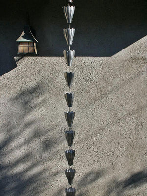 Aluminum XL Scallop Cups Rain Chain full view hanging from a gutter
