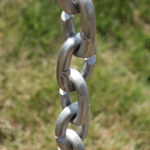 view looking down on XL Cast Oval Links Rain Chain in clear powder-coated aluminum