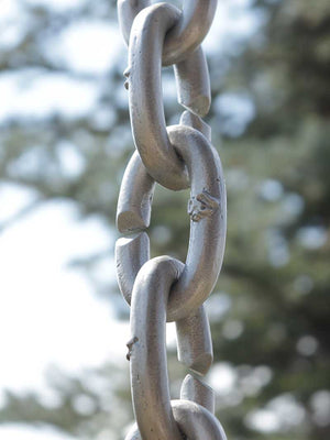 Longer length view of XL Cast Oval Links Rain Chain in clear powder-coated aluminum