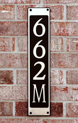 Custom address plaque on brick wall