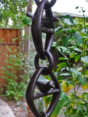 close up of Bird on a Wire Link Rain Chain in Bronze