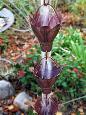 Bluebell Cups Copper Rain Chain with water flowing through multiple cups