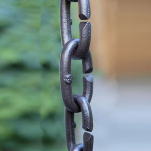 Closeup of Cast Oval Links Rain Chain in bronze