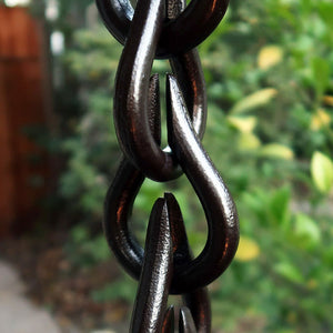 Close up of bronze droplet rain chain