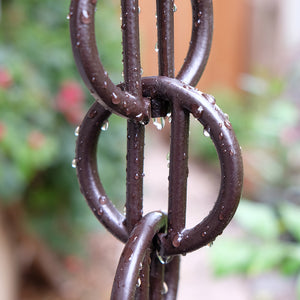 Close up of bronze Cast Zen Loops Rain Chain