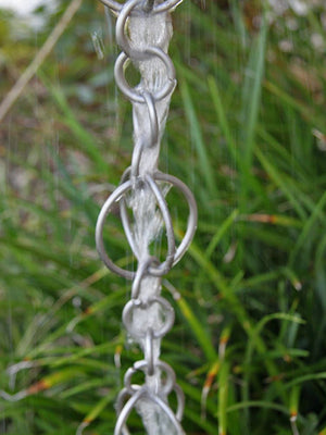 Stainless steel Circles Link Rain Chain with water flowing through it