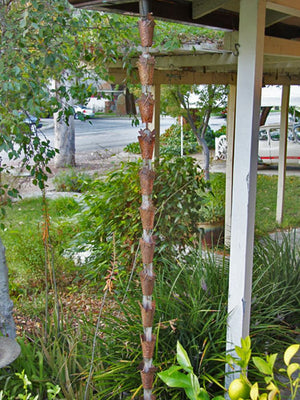 Dragonfly Theme Copper Rain Chain on house with water flowing through multiple cups